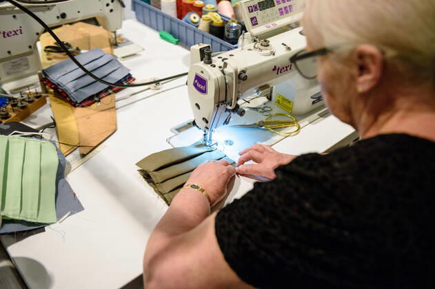 April 20, 2020: Chef Directrice DAGMAR HARTMANN can be seen during the process of making a mask in the manufacture of the Luxury Tie Auerbach in the Hackesche HoÂ¶fe in Berlin Mitte. The company produces mouth-nose-masks made of noble fabrics, partly matching ties or bow ties. - ZUMAs172 20200420_zap_s172_027 Copyright: xJanxScheunertx