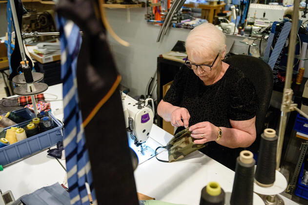 April 20, 2020: Chef Directrice DAGMAR HARTMANN can be seen during the process of making a mask in the manufacture of the Luxury Tie Auerbach in the Hackesche HoÂ¶fe in Berlin Mitte. The company produces mouth-nose-masks made of noble fabrics, partly matching ties or bow ties. - ZUMAs172 20200420_zap_s172_030 Copyright: xJanxScheunertx