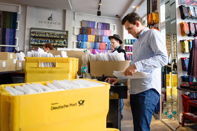 April 20, 2020: Boxes with goods in front of and company employees can be seen in the manufacture of the Luxury Tie Auerbach in the Hackesche HoÂ¶fe in Berlin Mitte. The company produces mouth-nose-masks made of noble fabrics, partly matching ties or bow ties. - ZUMAs172 20200420_zap_s172_032 Copyright: xJanxScheunertx