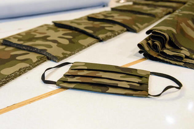 April 20, 2020: A protective mask with carmoflage pattern can be seen during the process of making a mask in the manufacture of the Luxury Tie Auerbach in the Hackesche HoÂ¶fe in Berlin Mitte. The company produces mouth-nose-masks made of noble fabrics, partly matching ties or bow ties. - ZUMAs172 20200420_zap_s172_038 Copyright: xJanxScheunertx