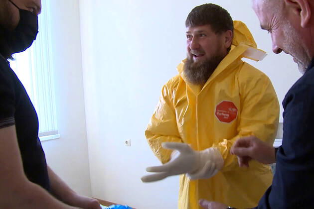 GROZNY, RUSSIA - APRIL 20, 2020: Chechnya Head Ramzan Kadyrov (C) in a chemical protection suit during a visit to Grozny s clinical hospital No 4 treating coronavirus patients. As of 20 April 2020, the Chechen Republic has registered 219 COVID-19 cases with 23 recoveries and 5 deaths. Video screen grab Grozny TV Channel TASS  TS0D6747