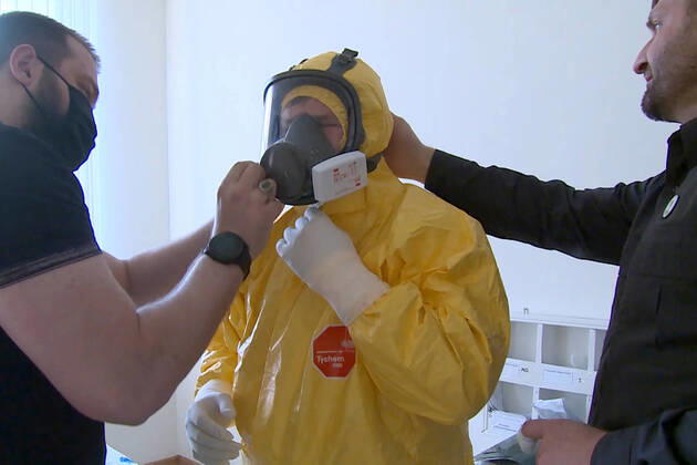 GROZNY, RUSSIA - APRIL 20, 2020: Chechnya Head Ramzan Kadyrov (C) in a chemical protection suit during a visit to Grozny s clinical hospital No 4 treating coronavirus patients. As of 20 April 2020, the Chechen Republic has registered 219 COVID-19 cases with 23 recoveries and 5 deaths. Video screen grab Grozny TV Channel TASS  TS0D6748