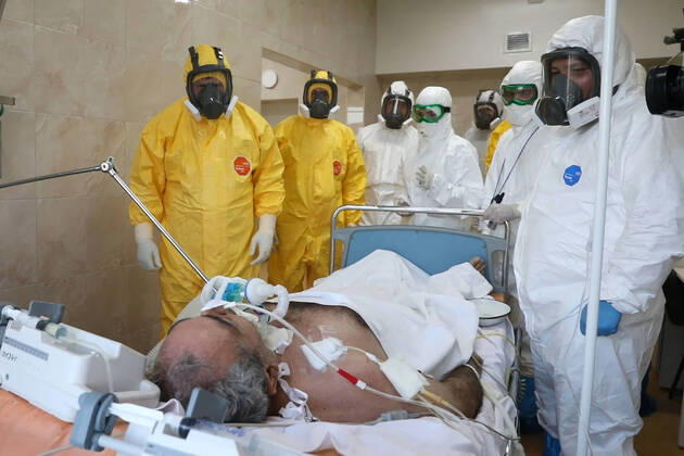 GROZNY, RUSSIA - APRIL 20, 2020: Chechnya Head Ramzan Kadyrov (L) in a chemical protection suit during a visit to Grozny s clinical hospital No 4 treating coronavirus patients. As of 20 April 2020, the Chechen Republic has registered 219 COVID-19 cases with 23 recoveries and 5 deaths. Video screen grab Grozny TV Channel TASS  TS0D674D