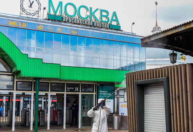 MOSCOW, RUSSIA - APRIL 20, 2020: An employee of the Russian Emergencies Ministry disinfecting the Yaroslavsky railway station amid the ongoing COVID-19 coronavirus pandemic. Russian Emergencies Ministry TASS  TS0D676D