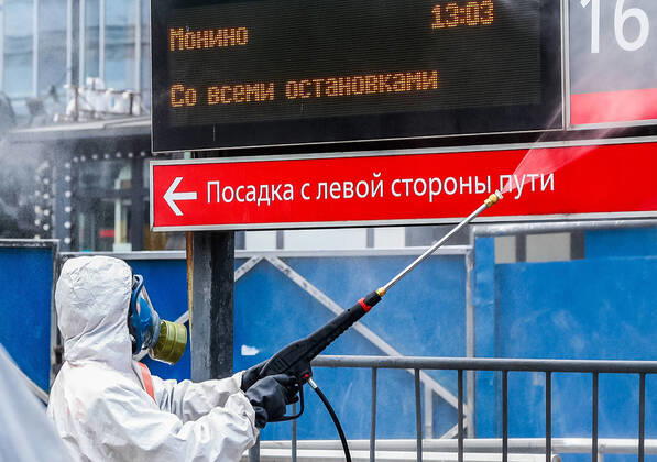 MOSCOW, RUSSIA - APRIL 20, 2020: An employee of the Russian Emergencies Ministry disinfecting the Yaroslavsky railway station amid the ongoing COVID-19 coronavirus pandemic. Russian Emergencies Ministry TASS  TS0D6770
