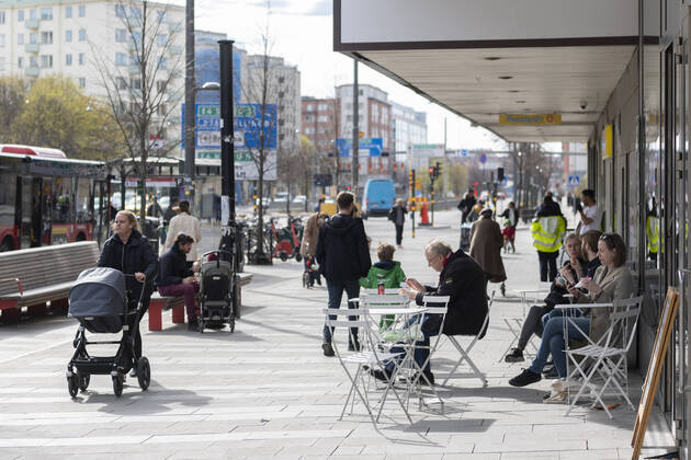 People eat icecream at an outdoor café as others pass by, amid the coronavirus disease COVID 19 outbreak, in central Stockholm, Sweden, on April 20, 2020 STOCKHOLM SWEDEN x11950x,  Copyright: xAlixLorestani TTx SWEDEN DAILY LIFE CORONA