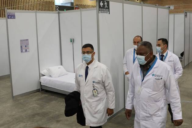 Health workers walk on a pavillion converted on a transitory hospital due the coronavirus crisis, in Bogota, Colombia, 20 April 2020. Corferias, the major ferial centre of Colombia, will works as Transitory Hospital Centre to receiving patients diferent to COVID-19 disease as measure to support the medical system during the coronavirus pandemic. Open transitory hospital in Bogota !ACHTUNG: NUR REDAKTIONELLE NUTZUNG!  Copyright: xCarlosxOrtegax AME4040 20200420-637230112518009349