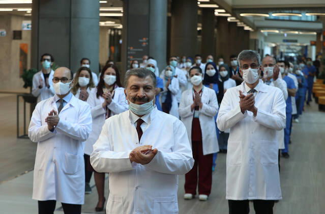 (200420) -- ISTANBUL, April 20, 2020 (Xinhua) -- Turkish Health Minister Fahrettin Koca (Front) attends the opening ceremony of the Basaksehir City Hospital in Istanbul, Turkey, on April 20, 2020. The first phase of a new mega-hospital, which will be used for treating COVID-19 patients, was inaugurated on Monday in Istanbul. The death toll of the virus in Turkey climbed to 2,017 and the confirmed cases totaled 86,306 on Sunday, according to the latest figures of the Health Ministry. (Xinhua) TURKEY-ISTANBUL-COVID-19-NEW MEGA-HOSPITAL