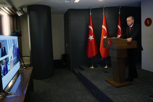 (200420) -- ISTANBUL, April 20, 2020 (Xinhua) -- Turkish President Recep Tayyip Erdogan attends the opening ceremony of the Basaksehir City Hospital via video conference in Istanbul, Turkey, on April 20, 2020. The first phase of a new mega-hospital, which will be used for treating COVID-19 patients, was inaugurated on Monday in Istanbul. The death toll of the virus in Turkey climbed to 2,017 and the confirmed cases totaled 86,306 on Sunday, according to the latest figures of the Health Ministry. (Xinhua) TURKEY-ISTANBUL-COVID-19-NEW MEGA-HOSPITAL