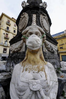 A protective mask is placed on a statue of a sphinx in Piazza Mercato (Marketplace Square), one of the most symbolic and historical places in Naples. Government Decree declaring all of Italy a protected area to combat Covid-19 - Coronavirus infection. Copyright: xSalvatorexLaportax xIPAx xKontrolabx