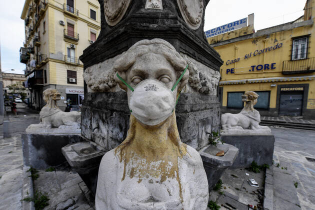 A protective mask is placed on a statue of a sphinx in Piazza Mercato (Marketplace Square), one of the most symbolic and historical places in Naples. Government Decree declaring all of Italy a protected area to combat Covid-19 - Coronavirus infection. Copyright: xSalvatorexLaportax xIPAx xKontrolabx