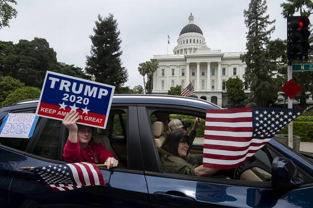 April 20, 2020, Sacramento, CA, USA: Demonstrators drives around the California Capitol in Sacramento on Monday, April 20, 2020, to protest the state s stay-at-home orders to slow the spread of the coronavirus. Sacramento USA - ZUMAj89_ 20200420_zaf_j89_025 Copyright: xPaulxKitagakixJr.x