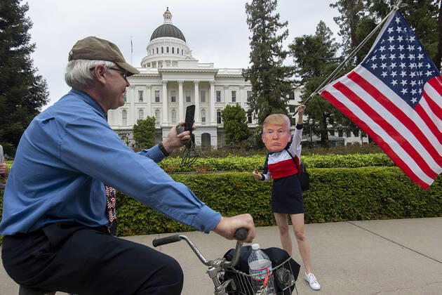 April 20, 2020, Sacramento, CA, USA: A woman identified as Miss America demonstrates at the California Capitol in Sacramento on Monday, April 20, 2020, to protest the state s stay-at-home orders to slow the spread of the coronavirus. Sacramento USA - ZUMAj89_ 20200420_zaf_j89_026 Copyright: xPaulxKitagakixJr.x