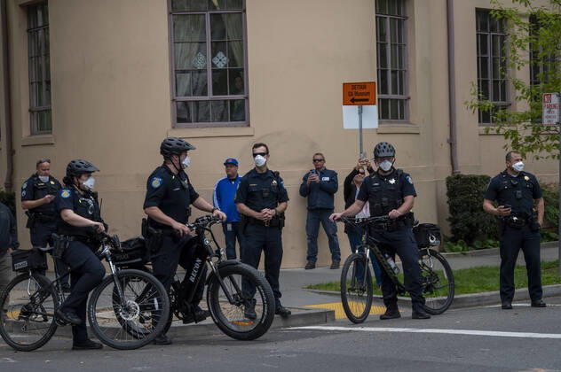 April 21, 2019, Sacramento, California, USA: Sacramento Police officers stand by as demonstrators converged on the California Capitol in Sacramento on Monday, April 20, 2020, to protest the state s stay-at-home orders to slow the spread of the coronavirus. Sacramento USA - ZUMAby1_ 20190421_zap_by1_004 Copyright: xRenÃ exC.xByerx