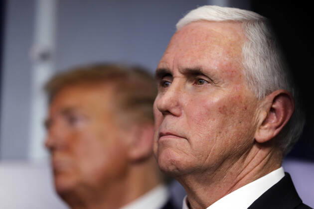U.S. President Donald Trump and Vice President Mike Pence listen during the Coronavirus Task Force briefing at the White House in Washington DC on Monday, April 20, 2020. State leaders and health experts say that the lack of tests for Covid-19 hampers the fast reopening of the country that is desired by the administration.  wax20200420110 TasosxKatopodis