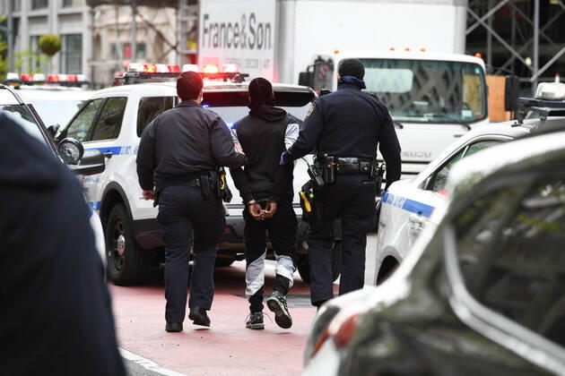 April 20, 2020, New York, New York, United States: As some red state governors consider relaxing social distancing policies, New York City police arrest a man who had allegedly taken part in an illegal gathering of more than two dozen people in ManhattanÃ¢â‚¬â ¢s Flatiron District Monday, potentially violating restrictions in place amid the Coronavirus epidemic. New York United States - ZUMAl113 20200420_zap_l113_001 Copyright: xMiguelxJuarezxLugox
