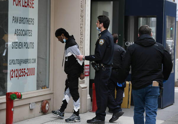 April 20, 2020, New York, New York, United States: As some red state governors consider relaxing social distancing policies, New York City police arrest a man who had allegedly taken part in an illegal gathering of more than two dozen people in ManhattanÃ¢â‚¬â ¢s Flatiron District Monday, potentially violating restrictions in place amid the Coronavirus epidemic. New York United States - ZUMAl113 20200420_zap_l113_002 Copyright: xMiguelxJuarezxLugox