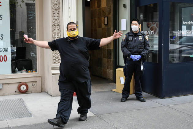 April 20, 2020, New York, New York, United States: As some red state governors consider relaxing social distancing policies, New York City police ticket a man who had allegedly taken part in an illegal gathering of more than two dozen people in ManhattanÃ¢â‚¬â ¢s Flatiron District Monday, potentially violating restrictions in place amid the Coronavirus epidemic. New York United States - ZUMAl113 20200420_zap_l113_003 Copyright: xMiguelxJuarezxLugox