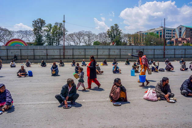April 20, 2020, Kathmandu, Nepal: Volunteers serve food and water to the needy and homeless people on the 28th day of a nationwide lockdown..Nepal government-imposed nationwide lockdown as a preventive measure against the spread of COVID-19 coronavirus. Kathmandu Nepal - ZUMAs197 20200420_zaa_s197_088 Copyright: xSunilxPradhanx