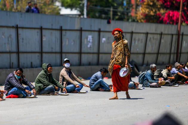April 20, 2020, Kathmandu, Nepal: Volunteers serve food and water to the needy and homeless people on the 28th day of a nationwide lockdown..Nepal government-imposed nationwide lockdown as a preventive measure against the spread of COVID-19 coronavirus. Kathmandu Nepal - ZUMAs197 20200420_zaa_s197_089 Copyright: xSunilxPradhanx