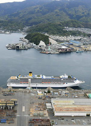 New coronavirus Photo taken from a Kyodo News helicopter on April 21, 2020, shows the Costa Atlantica cruise ship anchored at a port in Nagasaki, southwestern Japan. Testing continues after a novel coronavirus infection was confirmed the previous day on the vessel that docked at the port Jan. 29, carrying 623 crew members and no passengers. 