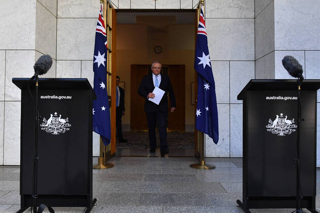 SCOTT MORRISON CORONAVIRUS UPDATE, Prime Minister Scott Morrison arrives at a press conference in Canberra, Tuesday, April 21, 2020. ( NO ARCHIVING, EDITORIAL USE ONLY, NO USE IN BOOKS WITHOUT CONSENT Canberra ACT AUSTRALIA  Copyright: xMICKxTSIKASx 20200421001464521597