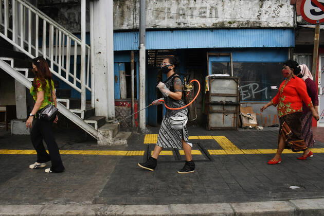 April 21, 2020, Jakarta, Jakarta, Indonesia: Darma wanita residents sprayed disinfectants in the local environment on April 21,2020. By walking residents kampung melayu , especially women spraying spray in the environment in the form of concern eradicating corona by wearing Kebaya clothes on National Kartini Day. Jakarta Indonesia - ZUMAr173 20200421_zip_r173_011 Copyright: xDasrilxRoszandix