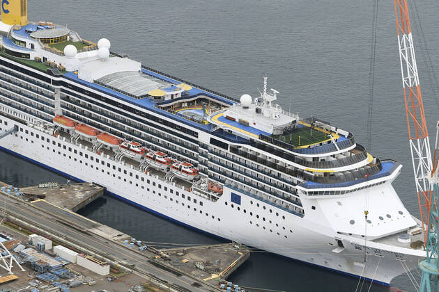 New coronavirus Photo taken from a Kyodo News helicopter on April 21, 2020, shows the Costa Atlantica cruise ship anchored at a port in Nagasaki, southwestern Japan. Testing continues after a novel coronavirus infection was confirmed the previous day on the vessel that docked at the port Jan. 29, carrying 623 crew members and no passengers. 