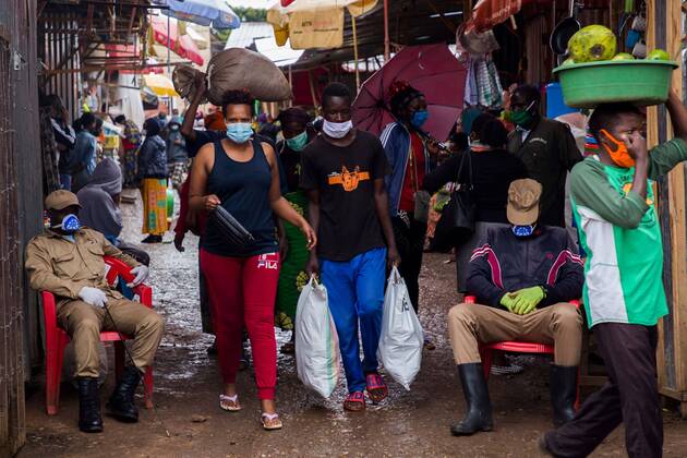 (200421) -- KIGALI, April 21, 2020 -- People are seen wearing face masks while leaving a market in Kigali, capital city of Rwanda, on April 20, 2020. Rwandan health minister on Saturday called on the public to embrace wearing of face masks while moving in public places and staying at home as part of the efforts to contain COVID-19. (Photo by Xinhua) RWANDA-KIGALI-COVID-19 CyrilxNdegeya 