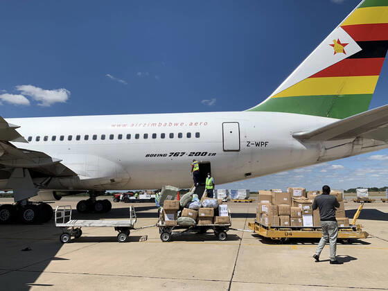 (200421) -- HARARE, April 21, 2020 (Xinhua) -- A charter flight unloads medical supplies and equipment after landing at Robert Gabriel Mugabe International Airport in Harare, Zimbabwe, April 20, 2020. Zimbabwe on Monday took delivery of a huge consignment of medical supplies and equipment sourced from China for use in the ongoing fight against the coronavirus pandemic. (Photo by Zhou Xuegong Xinhua) ZIMBABWE-HARARE-MEDICAL SUPPLIES 
