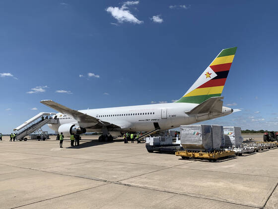 (200421) -- HARARE, April 21, 2020 (Xinhua) -- A charter flight unloads medical supplies and equipment after landing at Robert Gabriel Mugabe International Airport in Harare, Zimbabwe, April 20, 2020. Zimbabwe on Monday took delivery of a huge consignment of medical supplies and equipment sourced from China for use in the ongoing fight against the coronavirus pandemic. (Photo by Zhou Xuegong Xinhua) ZIMBABWE-HARARE-MEDICAL SUPPLIES 