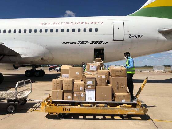 (200421) -- HARARE, April 21, 2020 (Xinhua) -- A charter flight unloads medical supplies and equipment after landing at Robert Gabriel Mugabe International Airport in Harare, Zimbabwe, April 20, 2020. Zimbabwe on Monday took delivery of a huge consignment of medical supplies and equipment sourced from China for use in the ongoing fight against the coronavirus pandemic. (Photo by Zhou Xuegong Xinhua) ZIMBABWE-HARARE-MEDICAL SUPPLIES 