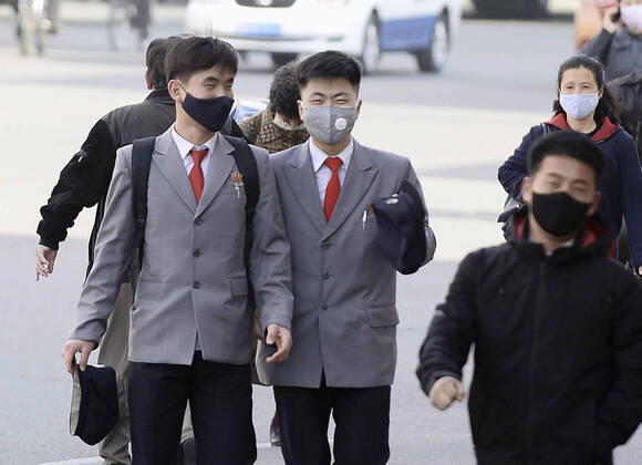 Scenes from Pyongyang People walk in Pyongyang on April 21, 2020, wearing masks amid concerns over the new coronavirus. CNN has reported that North Korean leader Kim Jong Un is in grave danger after surgery, citing a U.S. official with direct knowledge. 