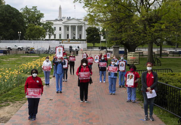 Registered Nurses hold a protest to call attention to healthcare workers nationwide who have been infected with COVID-19 and demanding the Trump administration provide extra PPE for healthcare workers during the coronavirus pandemic, at the White House in Washington, D.C. on Tuesday, April 21, 2020.  WAP20200421301 KEVINxDIETSCH