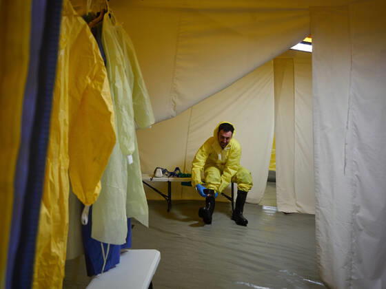 April 21, 2020, Pamplona, Navarra, SPAIN: DYA Navarra member wears an EPI suit to disinfect the stretchers used by the Hospital Complex of Navarra during the Covid-19 pandemic on April 21, 2020 in Pamplona, Spain Pamplona SPAIN - ZUMAa181 20200421_zaa_a181_033 Copyright: xEduardoxSanzx