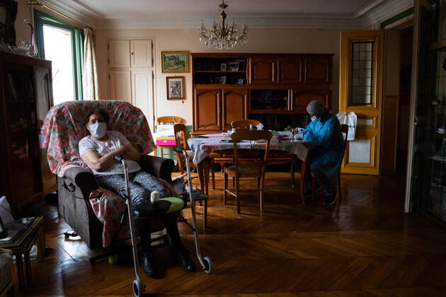 Paris, France, April 21, 2020 - Mrs. D., in her eighties, has just spent a dozen days in hospital after being infected with Coronavirus (Covid-19). Cured, she was able to return home, where Michele, a life assistant from the Neotine agency, goes several times a week to help her in her daily life.  Copyright: xAlexisxSciardx