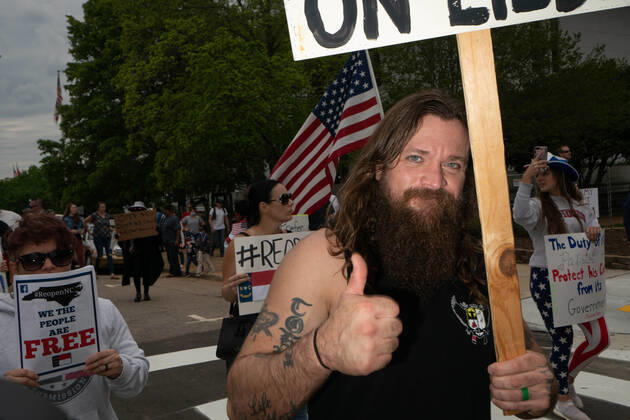 April 21, 2020, Raleigh, NC, USA: ReOpenNC protesters calling for ending or relaxing coronavirus executive orders in Raleigh, NC Tuesday, April 21, 2020. Raleigh USA - ZUMAd43_ 20200421_znp_d43_001 Copyright: xMehmetxDemircix