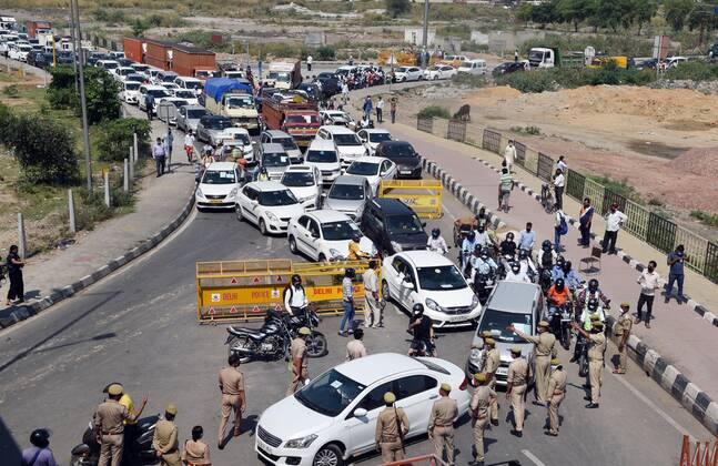 NEW DELHI, INDIA - APRIL 21: A heavy traffic jam at the Delhi-UP border in Ghazipur due to passage for commuters being stopped by Ghaziabad administration during lockdown against coronavirus on April 21, 2020 in New Delhi, India. The orders to seal the Ghaziabad borders were issued by District Magistrate Ajay Shankar Pandey on Monday, but many people were unaware of the directive. The decision was taken after six people who had come from Delhi tested positive for coronavirus, said Pandey in an order issued on April 20. (Photo by Ajay Aggarwal Hindustan Times) Major Traffic Jam As Delhi-Ghaziabad Border Shut By District Magistrate To Stop Covid-19 Spread