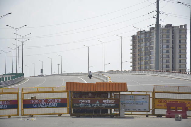GHAZIABAD, INDIA - APRIL 21: Police barricades blocking the way at the Delhi- Uttar Pradesh border at UP Gate on April 21, 2020 in Ghaziabad, India. Commuters were held up at Delhi-Ghaziabad border on Tuesday morning after the Ghaziabad district magistrate passed an order prohibiting movement to Delhi except for those involved in essential services or having a valid pass. (Photo by Sakib Ali Hindustan Times) Nationwide Lockdown In India To Curb Spread Of Coronavirus Covid-19 Pandemic