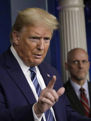 United States President Donald J. Trump speaks at the Coronavirus Task Force press briefing at the White House in Washington on April 21, 2020. At right is Stephen Hahn, Commissioner, US Food and Drug Administration (FDA). Copyright: xGripasx xPoolxviaxCNPx xMediaPunchx