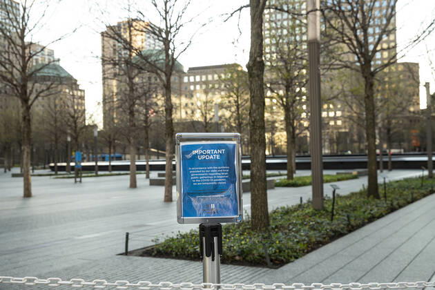 New York daily life amid COVID-19 pandemic Poster at 9 11 Memorial and Museum notifying about closing because of COVID-19 pandemic at World Trade Center New York New York United States Copyright: LevxRadin