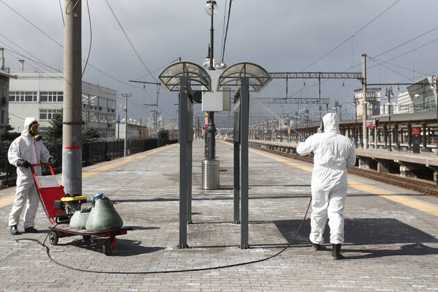 MOSCOW, RUSSIA - APRIL 22, 2020: Emercom workers in protective suits wash a platform with disinfectant at Kiyevsky railway station amid the ongoing COVID-19 pandemic. Sergei Fadeichev TASS  TS0D6A37
