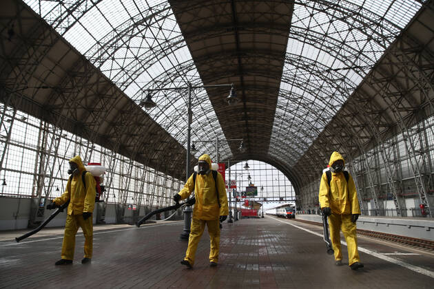 MOSCOW, RUSSIA - APRIL 22, 2020: Emercom workers in protective suits carry out disinfection procedures at Kiyevsky railway station amid the ongoing COVID-19 pandemic. Sergei Fadeichev TASS  TS0D6A3E