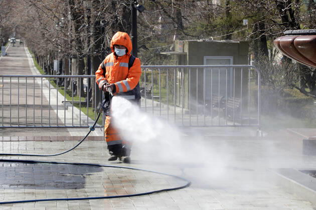 MOSCOW, RUSSIA - APRIL 22, 2020: A utility worker carries out disinfection procedures on Tverskoy Boulevard amid the ongoing COVID-19 pandemic; the Russian government has extended a paid period off work until April 30 nationwide to counter the spread of the COVID-19 infection. Mikhail Metzel TASS  TS0D6A41