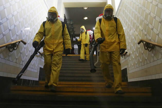 MOSCOW, RUSSIA - APRIL 22, 2020: Emercom workers in protective suits carry out disinfection procedures at Kiyevsky railway station amid the ongoing COVID-19 pandemic. Sergei Fadeichev TASS  TS0D6A54