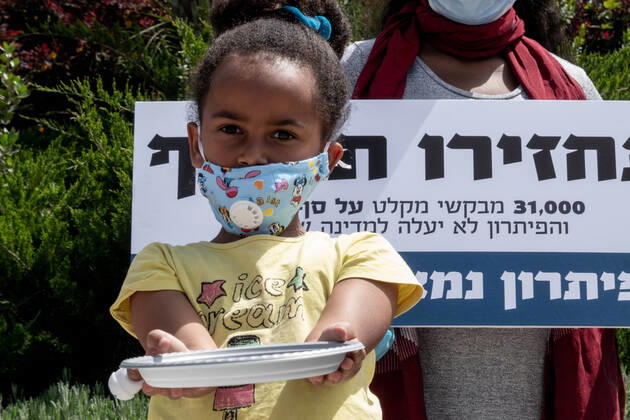 April 22, 2020, Jerusalem, Israel: Children with empty plates beg for food as African asylum seekers, a community of 31,000, stage a Ã¢â‚¬ËœGive Back Our MoneyÃ¢â‚¬â ¢ protest outside the Israeli parliament demanding wages confiscated by government be released immediately. Since 2017 the state has deducted 20% of asylum seekersÃ¢â‚¬â ¢ wages depositing them into accounts withdrawable only upon leaving the country or obtaining legal refugee status. The Coronavirus pandemic has left them with no income and no government assistance. Asylum seekers claim their socioeconomic situation was miserable to begin with and are now, in the COVID-19 crisis, on the brink of starvation and homelessness. Jerusalem Israel - ZUMAa126 20200422_zap_a126_015 Copyright: xNirxAlonx
