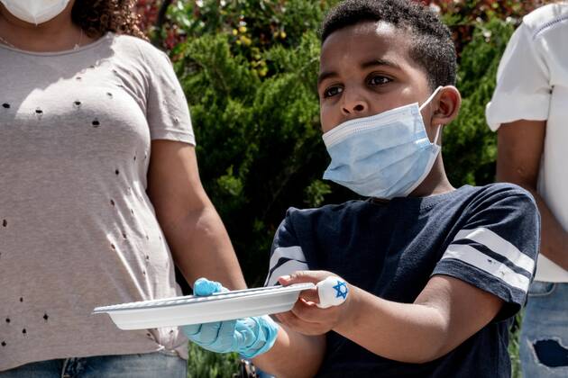 April 22, 2020, Jerusalem, Israel: Children with empty plates beg for food as African asylum seekers, a community of 31,000, stage a Ã¢â‚¬ËœGive Back Our MoneyÃ¢â‚¬â ¢ protest outside the Israeli parliament demanding wages confiscated by government be released immediately. Since 2017 the state has deducted 20% of asylum seekersÃ¢â‚¬â ¢ wages depositing them into accounts withdrawable only upon leaving the country or obtaining legal refugee status. The Coronavirus pandemic has left them with no income and no government assistance. Asylum seekers claim their socioeconomic situation was miserable to begin with and are now, in the COVID-19 crisis, on the brink of starvation and homelessness. Jerusalem Israel - ZUMAa126 20200422_zap_a126_016 Copyright: xNirxAlonx