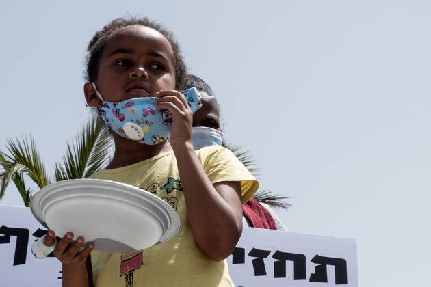 April 22, 2020, Jerusalem, Israel: Children with empty plates beg for food as African asylum seekers, a community of 31,000, stage a Ã¢â‚¬ËœGive Back Our MoneyÃ¢â‚¬â ¢ protest outside the Israeli parliament demanding wages confiscated by government be released immediately. Since 2017 the state has deducted 20% of asylum seekersÃ¢â‚¬â ¢ wages depositing them into accounts withdrawable only upon leaving the country or obtaining legal refugee status. The Coronavirus pandemic has left them with no income and no government assistance. Asylum seekers claim their socioeconomic situation was miserable to begin with and are now, in the COVID-19 crisis, on the brink of starvation and homelessness. Jerusalem Israel - ZUMAa126 20200422_zap_a126_018 Copyright: xNirxAlonx
