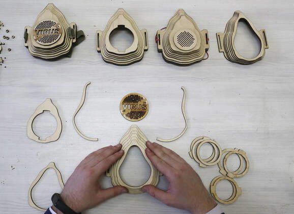 TATARSTAN, RUSSIA - APRIL 22, 2020: Radik Guryev, a teacher at an arts and crafts centre for children and youth in the town of Mamadysh, Tatarstan, shows how to assemble a reusable plywood respirator that he invented amid a shortage of conventional face masks during the pandemic of the novel coronavirus disease (COVID-19). The respirator includes a replaceable cotton pad filter. Yegor Aleyev TASS  TS0D6AA6