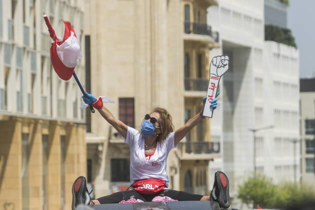April 22, 2020, Beirut, Lebanon: Protesters wearing protective masks demonstrate in Martyr s Square, Beirut in a convoy of cars with drivers honking their horns, waving the Lebanese national flag and leaning out of the car windows to protest against the deteriorating living conditions exacerbated since the government imposed lockdown measures to combat the spread of COVID-19 coronavirus..Where: Beirut, Lebanon.When: 22 Apr 2020.Credit: Amer GhazzalCover Images Beirut Lebanon - ZUMAc218 20200422_zia_c218_016 Copyright: xCOVERxImagesx